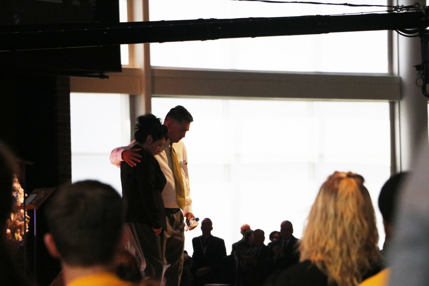 Maria and John Castillo, the parents of Kendrick Castillo, who was killed in the STEM School Highlands Ranch shooting, walk off stage at a celebration of life service on May 15. "I love you all," John Castillo said minutes earlier. "Thank you for loving my son."